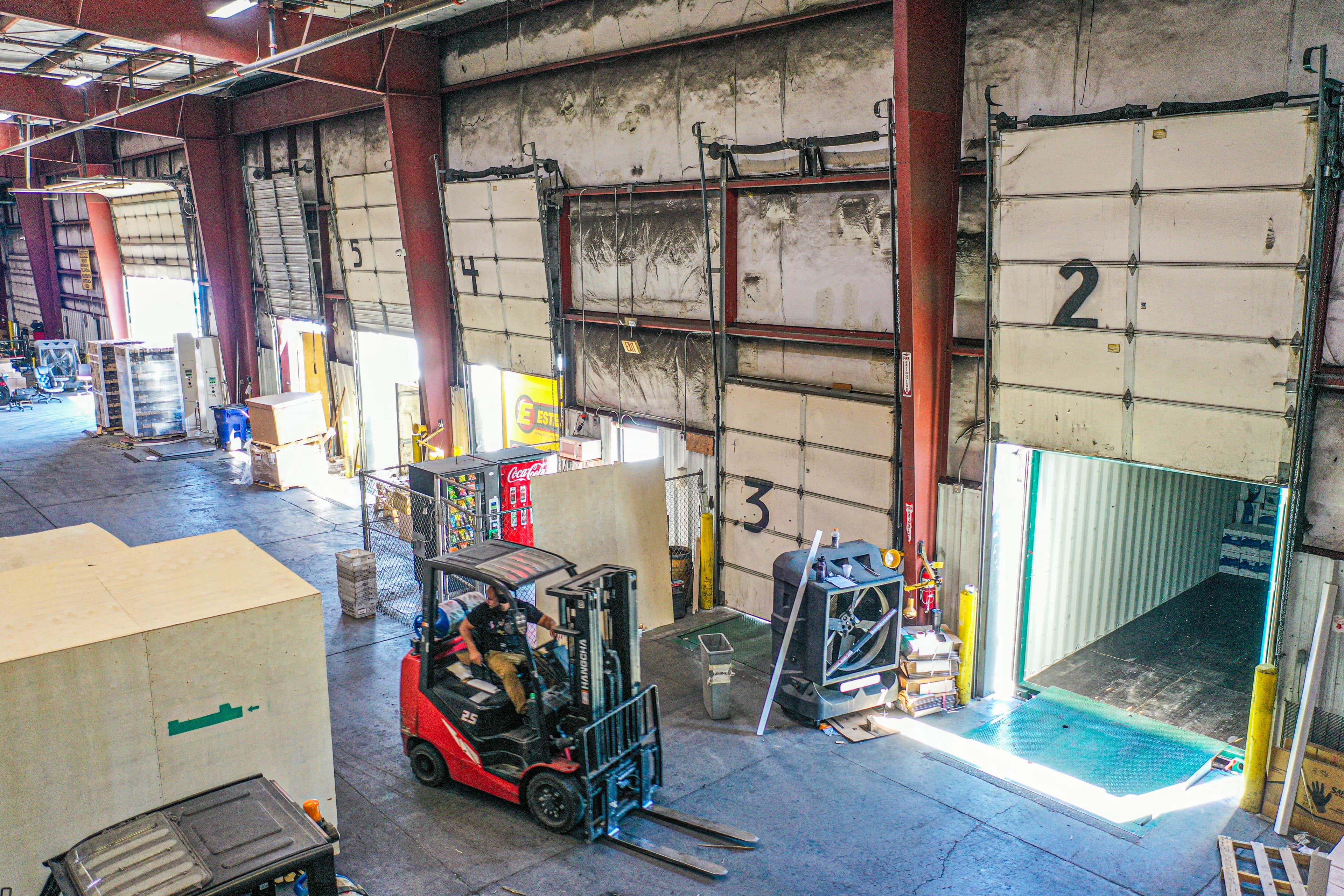 Aerial drone view of warehouse facility showing organized layout and infrastructure