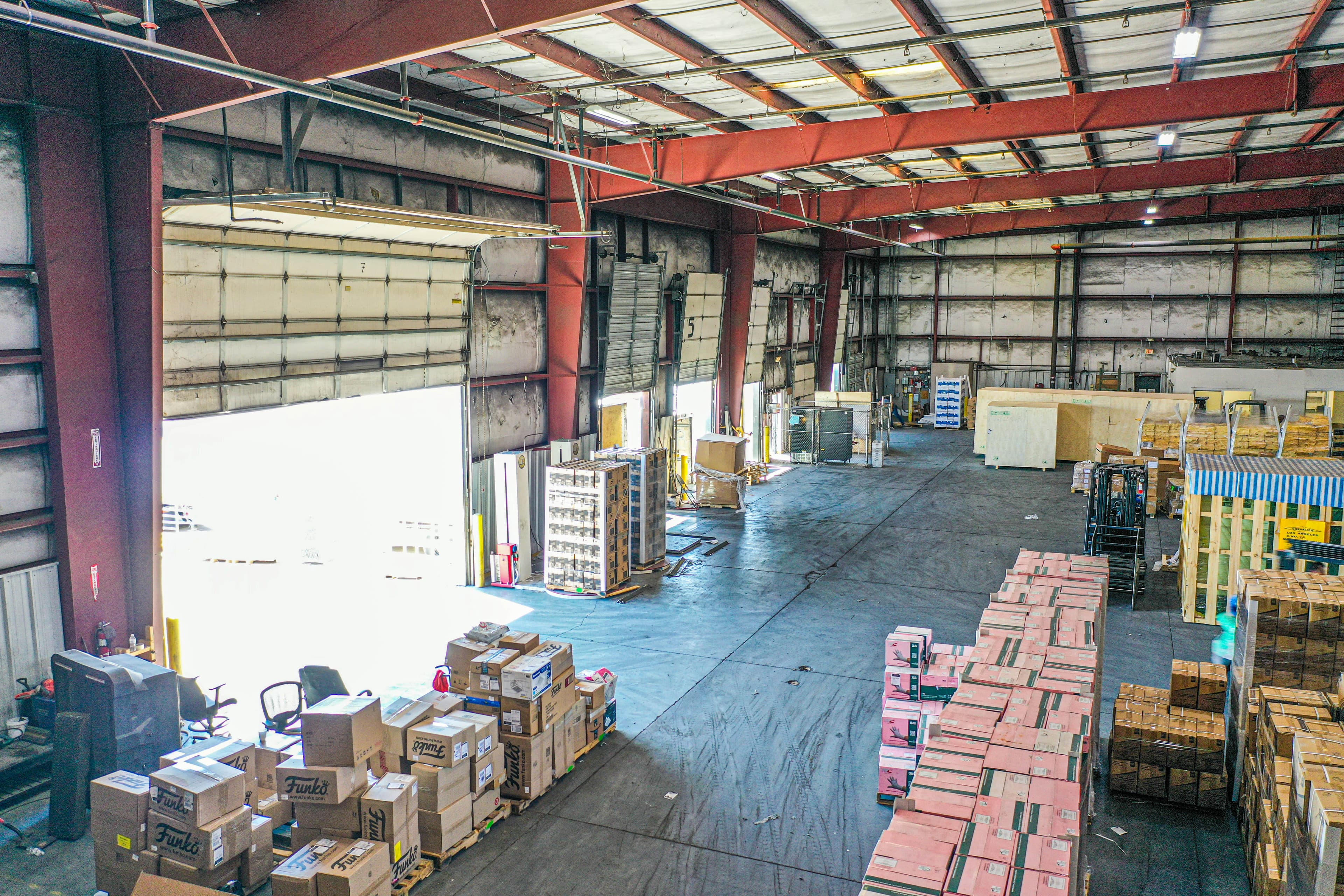 Aerial drone view of warehouse facility showing comprehensive operations area