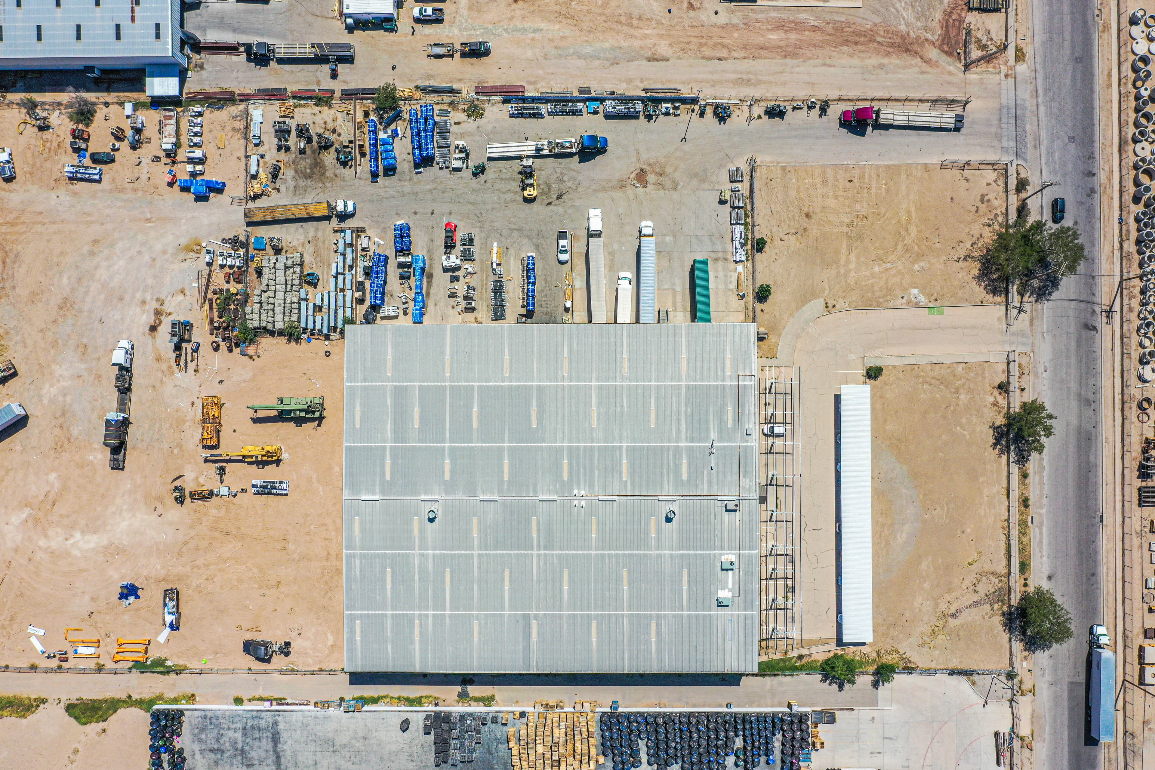 Aerial drone view of warehouse facility showing comprehensive operations and yard space